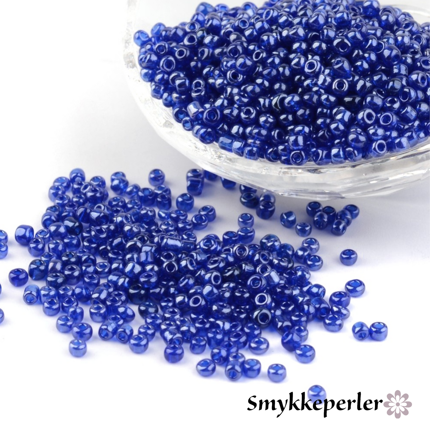 Seed beads blå transparent. Ca. 3 mm.