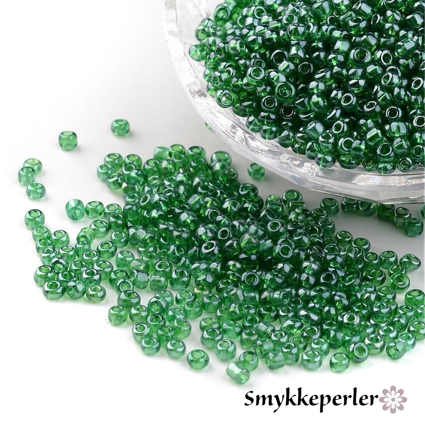 Seed beads grøn transparent. Ca. 3 mm.